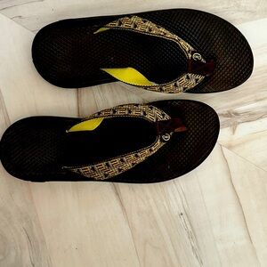 Brown and green Chaco flip flops